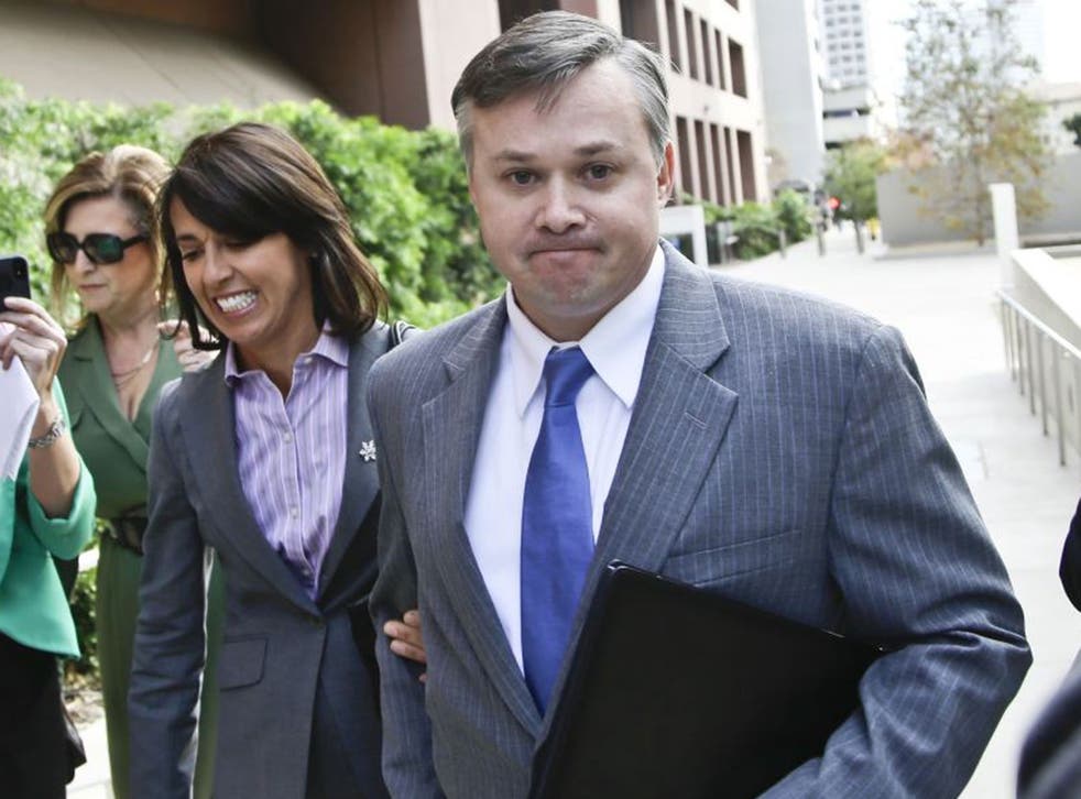 John Beliveau II, accompanied by attorney Gretchen von Helms, arrives at the federal courthouse, Wednesday Dec. 17, 2013, in San Diego