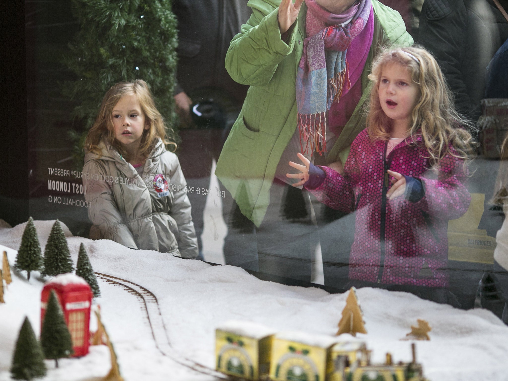 Winter gape: the window wonderland display this year has a magical effect on some of Selfridges' younger customers