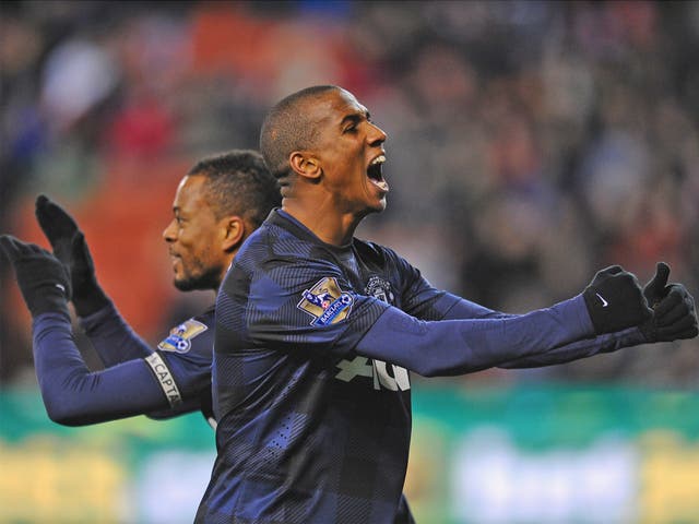 Goalscorers Patrice Evra and Ashley Young celebrate making the semi-finals