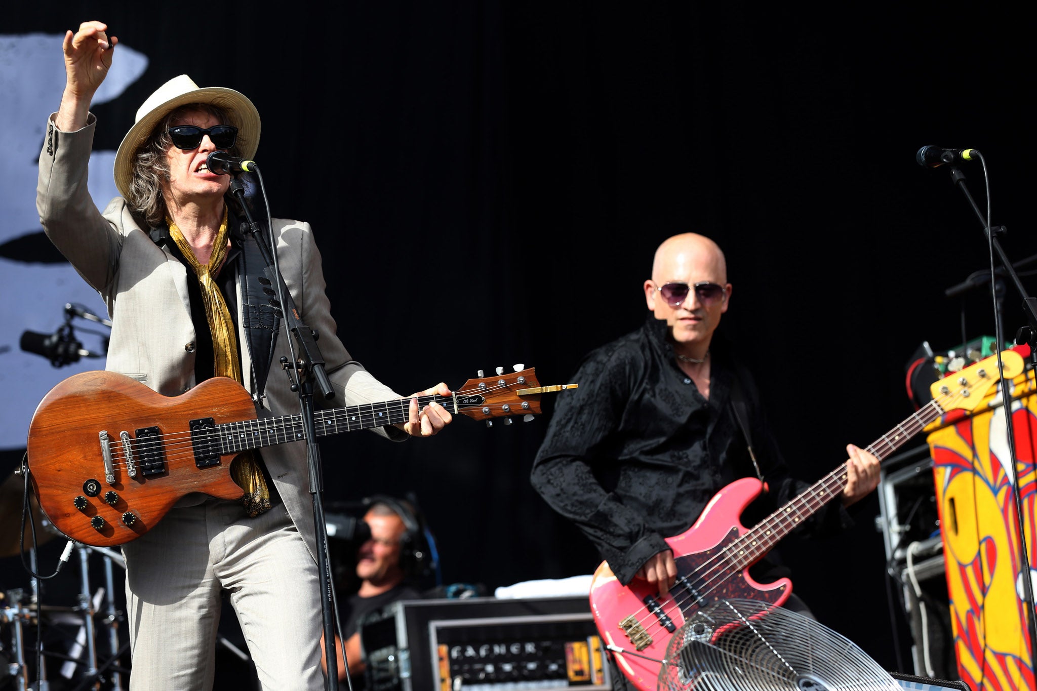 Mike Scott, singer of British band 'The Waterboys' and violinist Steve Wickham (L) perform on stage
