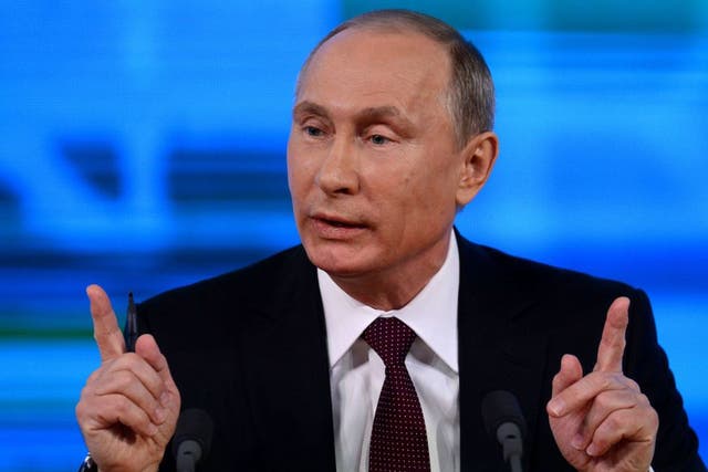 Russia's President Vladimir Putin speaks at his annual press conference in Moscow on 19 December 2013