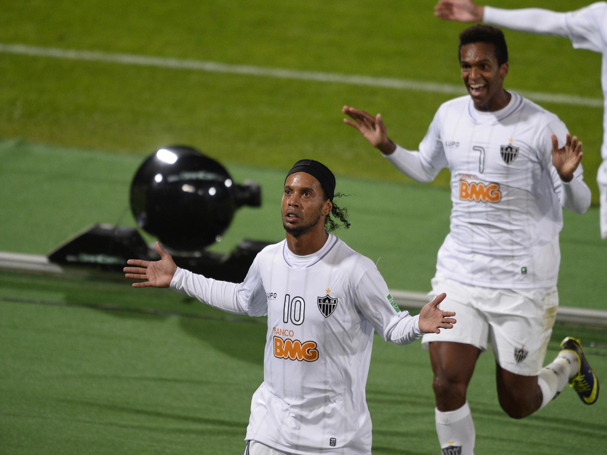 Atletico Mineiro forward Ronaldinho (L) celebrates with his teammate Jo after scoring a goal during their semi-final - however it wasn't enough to see them through to the final