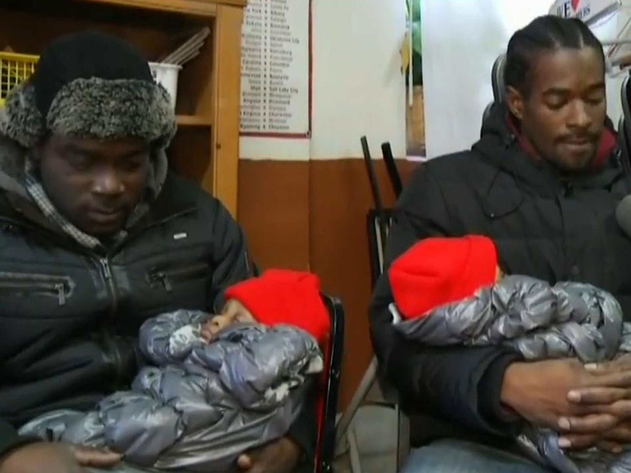 Jermaine Shirley, left, saved the life of two twins by catching them as they were thrown down a fire escape