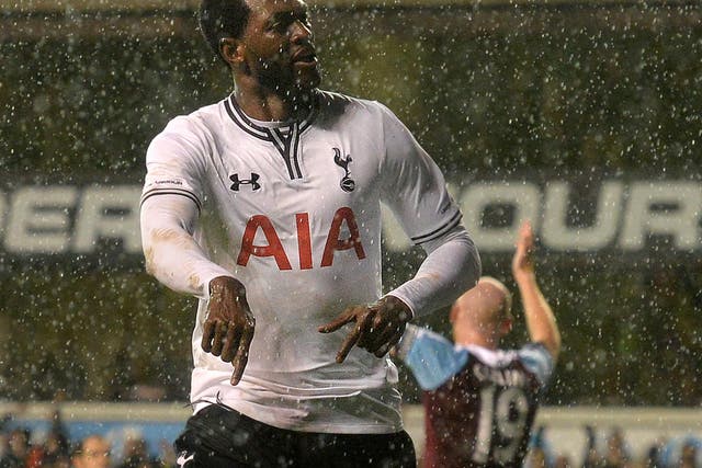Emmanuel Adebayor celebrates a goal against West Ham