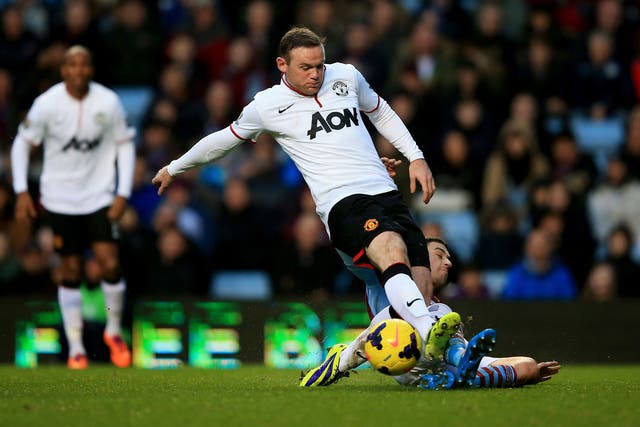 Wayne Rooney has a shot on goal blocked by Matthew Lowton during Manchester United's victory over Aston Villa