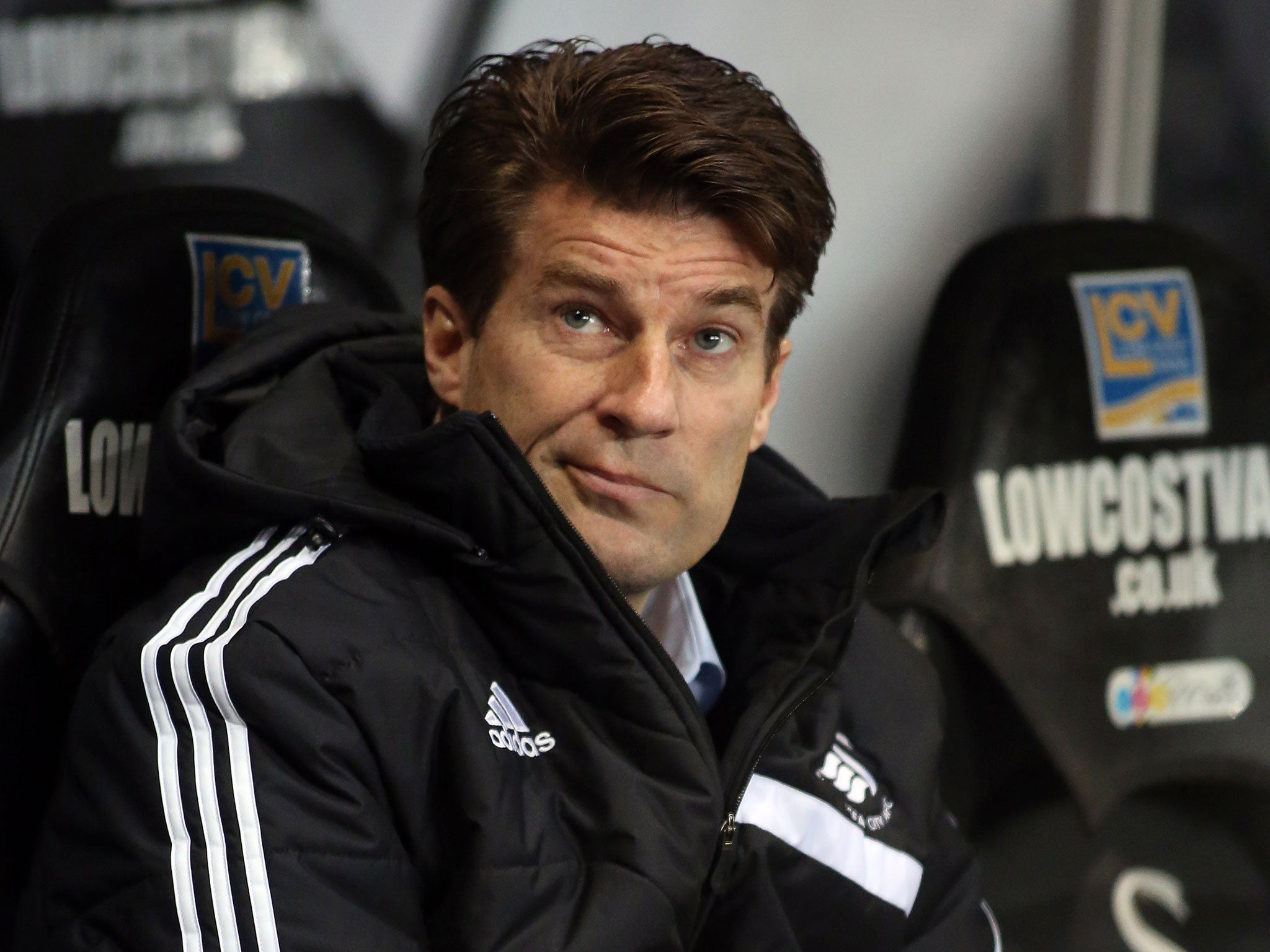 Swansea manager Michael Laudrup looks on from the touchline