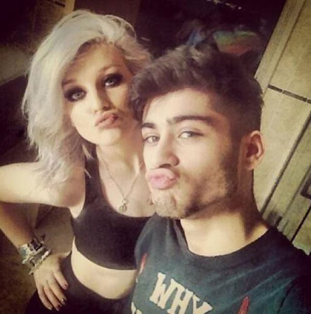 Zayn and Perrie in their selfie making full-on duck faces, kissy smooches as they pose next to each other