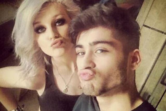 Zayn and Perrie in their selfie making full-on duck faces, kissy smooches as they pose next to each other