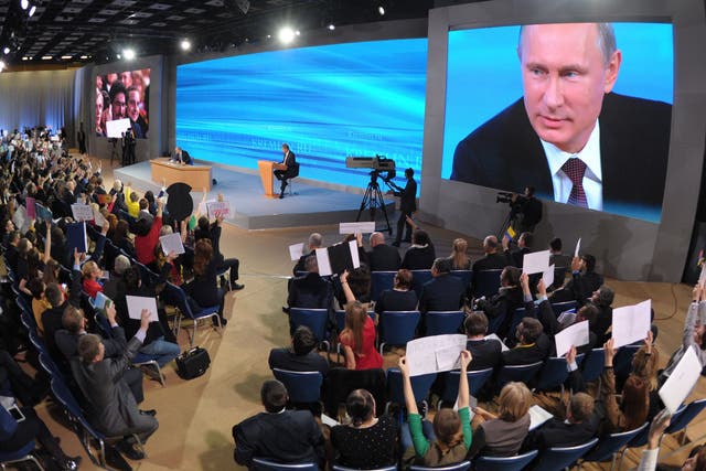 Russian President Vladimir Putin speaks during his annual press conference in Moscow; he later announced the surprise early release of the former Yukos oil tycoon
