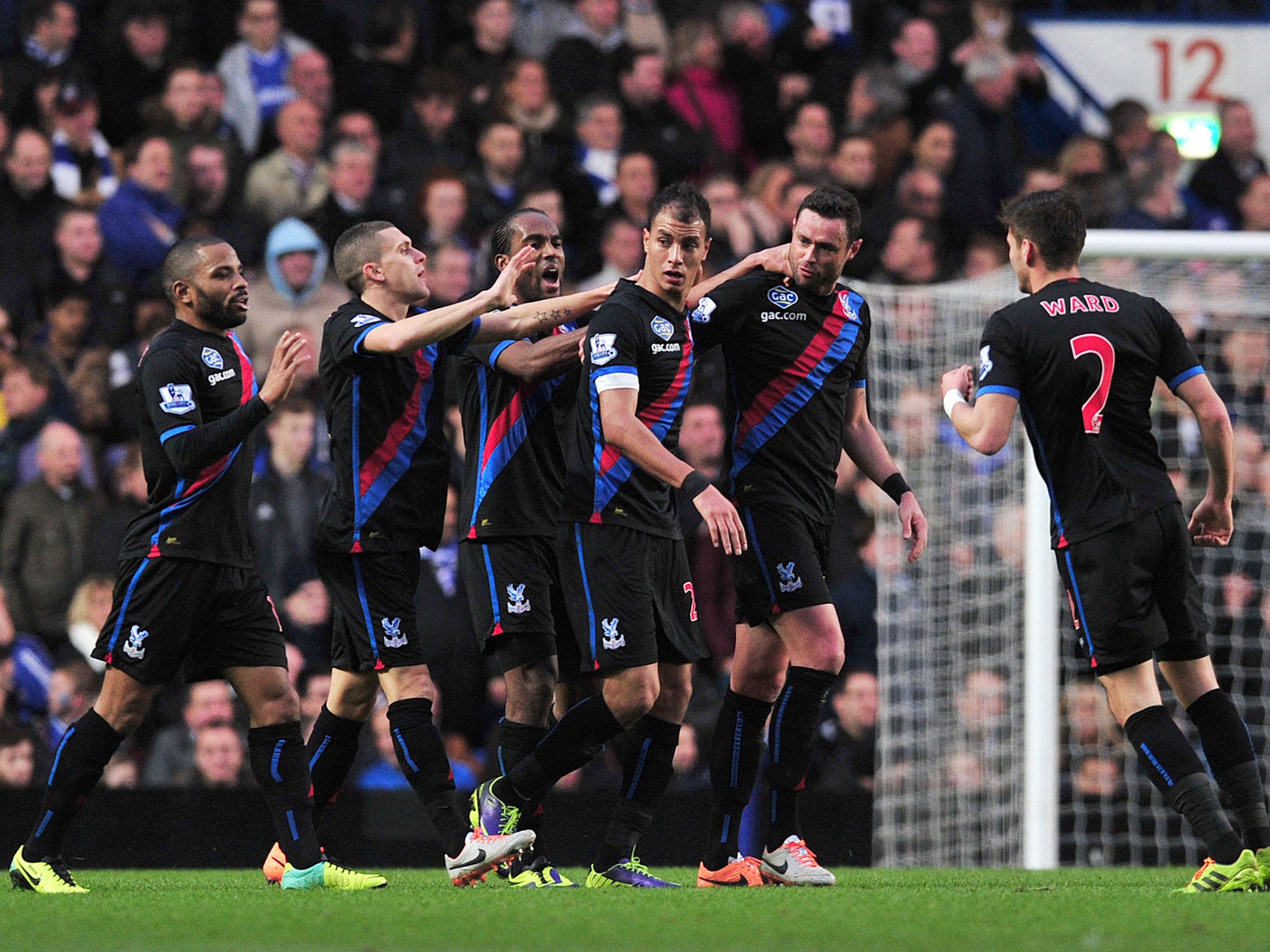 Crystal Palace players celebrate after Marouane Chamakh scores against Chelsea