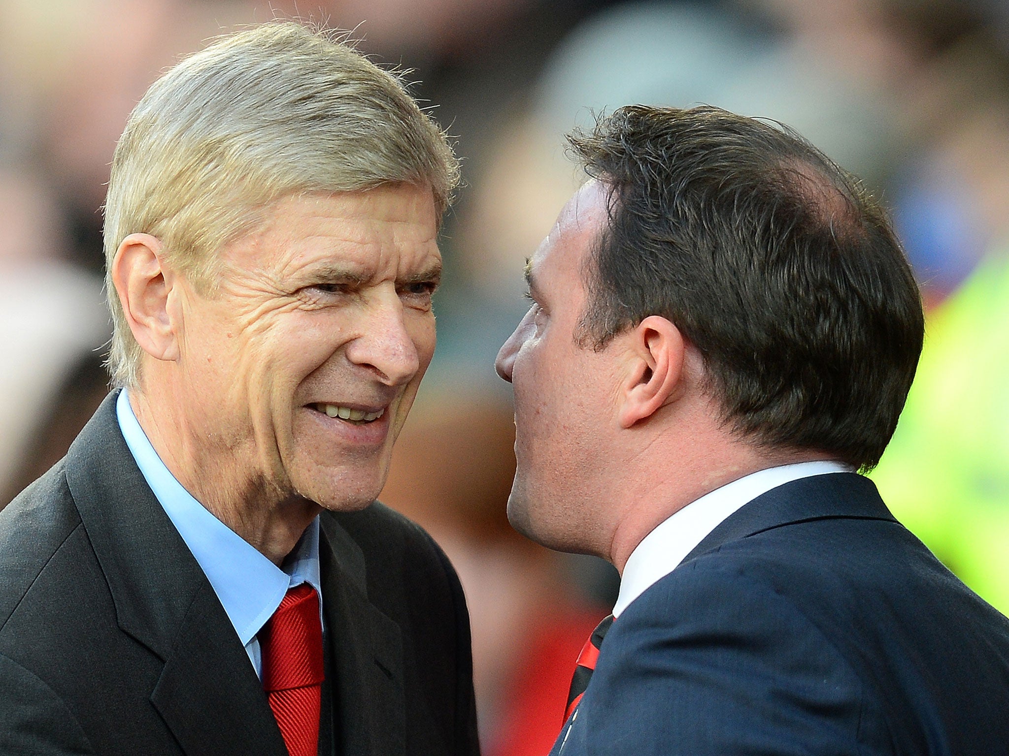 Arsene Wenger and Malky Mackay shake hands ahead of Arsenal's victory over Cardiff
