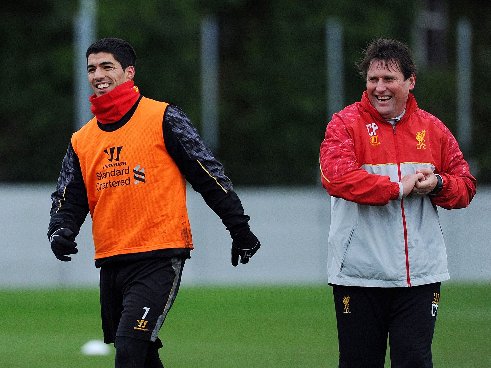 Luis Suarez laughing with Colin Pascoe during training