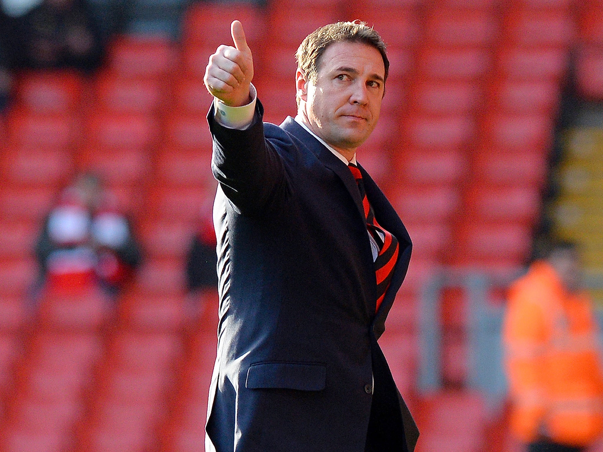 Cardiff City manager Malky Mackay gives the thumbs up to fans ahead of their match against Liverpool