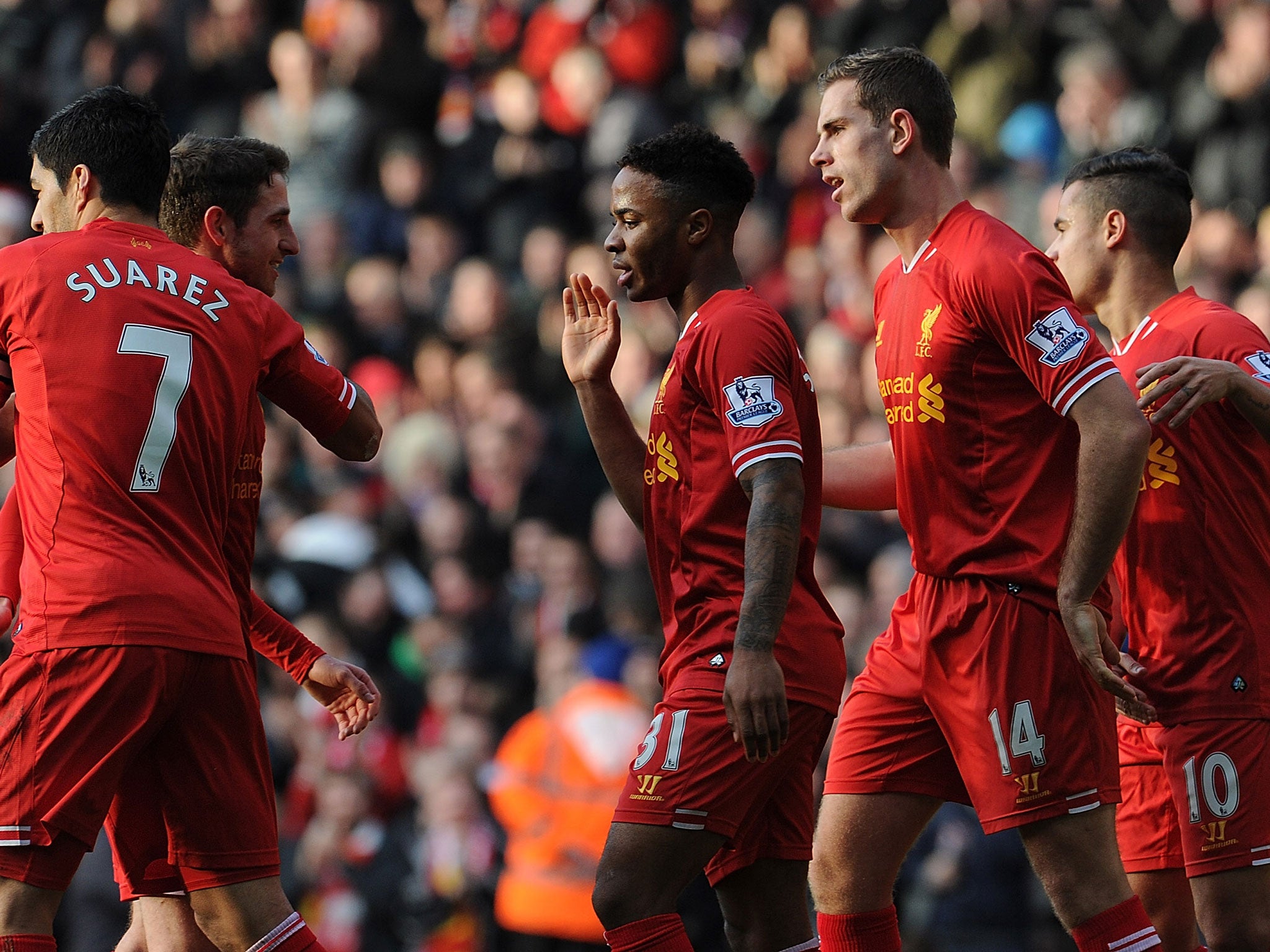 Raheem Sterling of Liverpool is congratulated