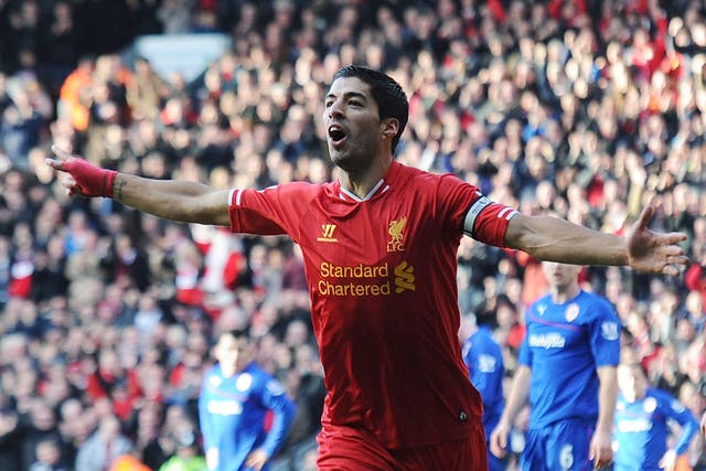 Luis Suarez celebrates after scoring for Liverpool against Cardiff City