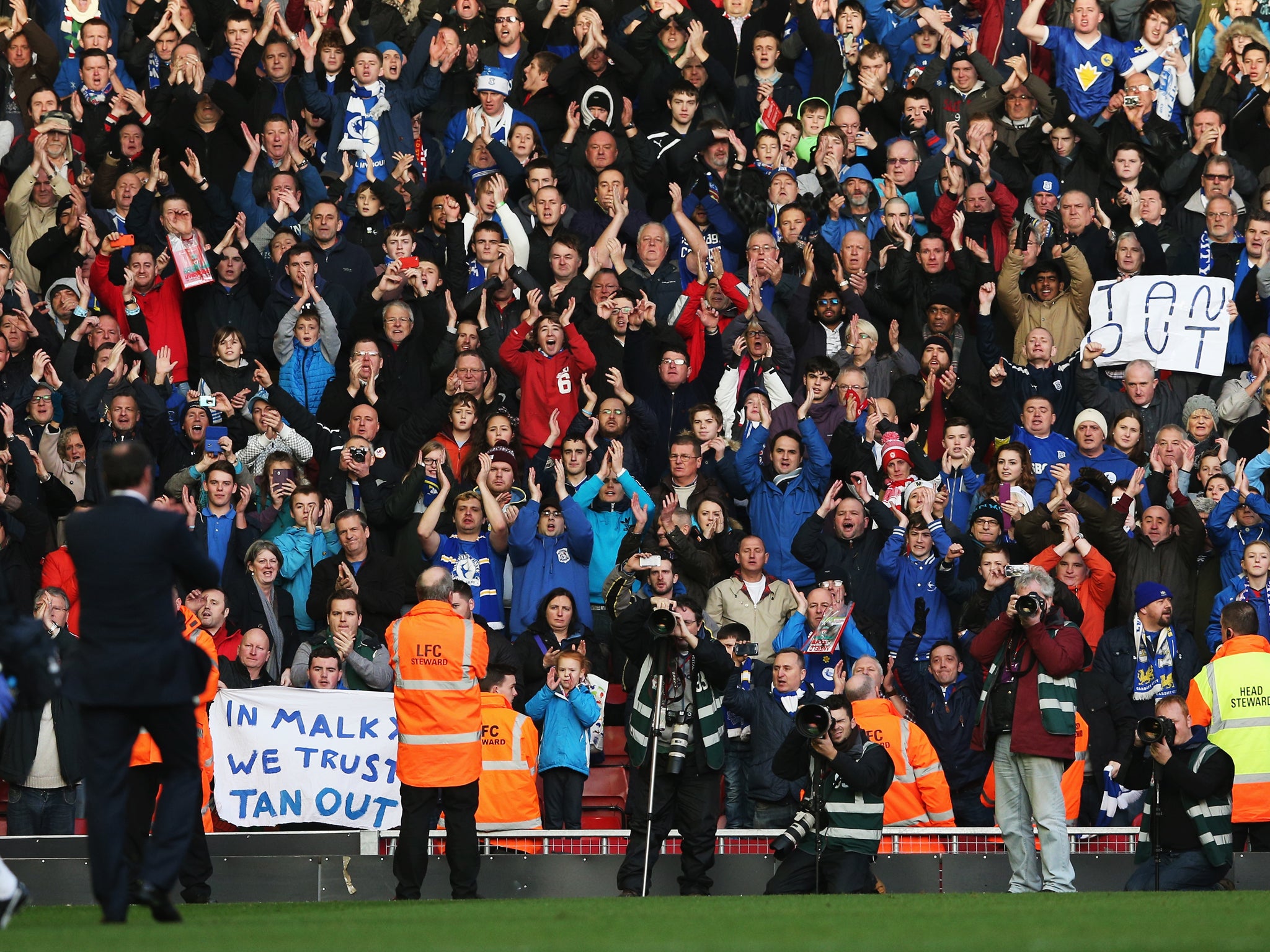 Malky Mackay applauds the Cardiff City fans following the 3-1 loss to Liverpool