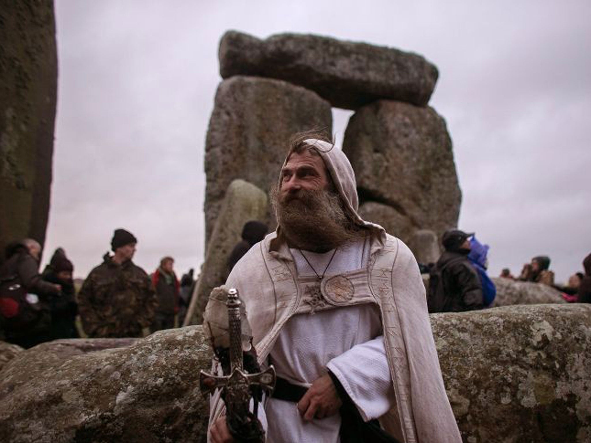 Druid Merlin poses for a photograph as druids, pagans and revellers gather, hoping to see the sun rise as they take part in a winter solstice ceremony at Stonehenge on December 21, 2013 in Wiltshire, England.