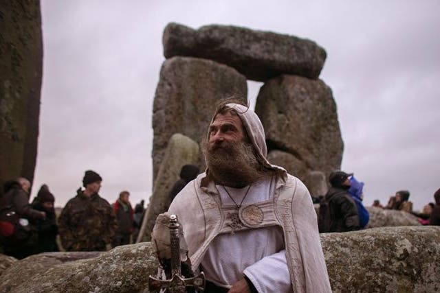  Druid Merlin  poses for a photograph as druids, pagans and revellers gather, hoping to see the sun rise as they take part in a winter solstice ceremony at Stonehenge on December 21, 2013 in Wiltshire, England.