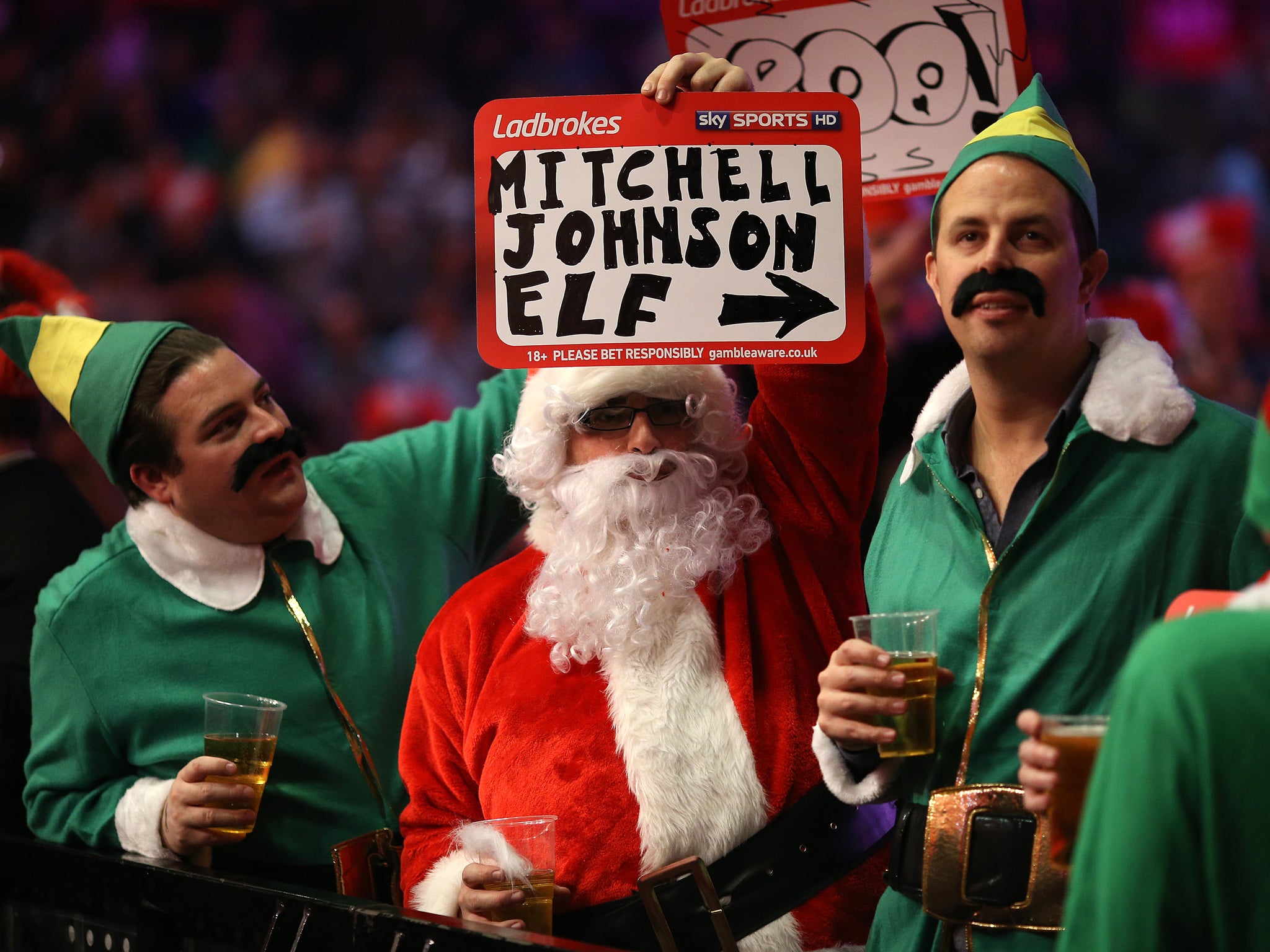 Fans at the World Darts Championship keep themselves entertained with the various fancy dress seen each night