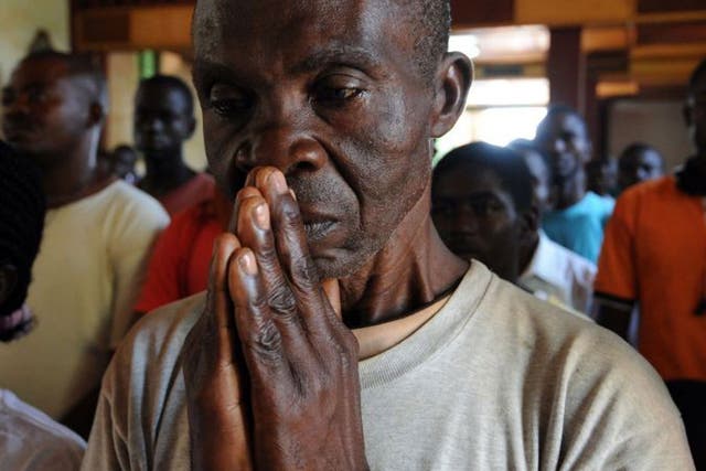 A man prays in the CAR; 600 have died since fighting started
