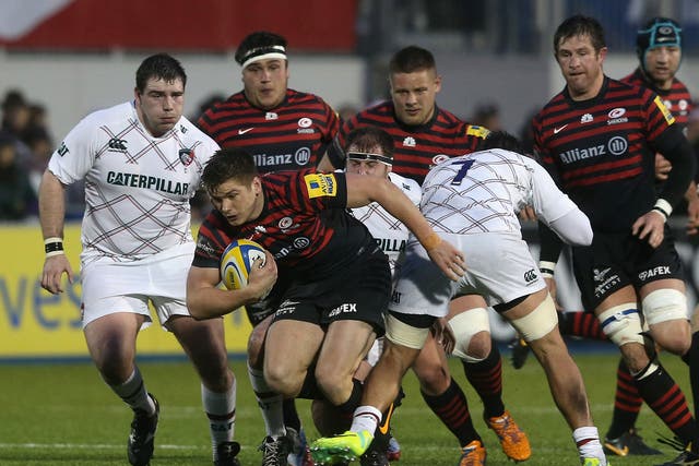 Owen Farrell tries to break through the Leicester defence
