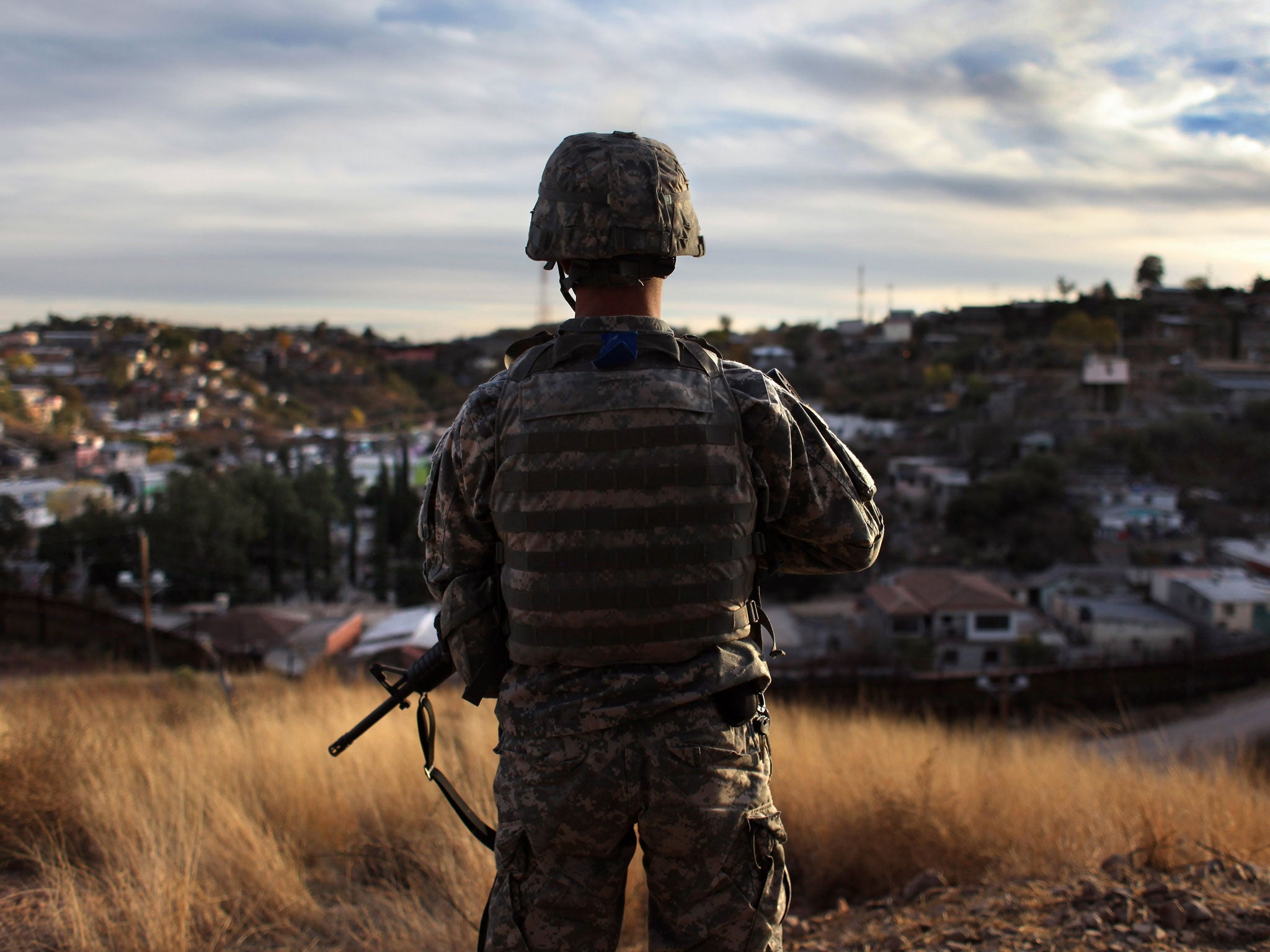 A National Guardsman at an observation post in Nogales, Arizona. Last year, a 16-year-old was shot 10 times here by Border Patrol agents