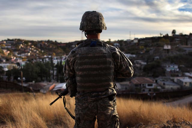 A National Guardsman at an observation post in Nogales, Arizona. Last year, a 16-year-old was shot 10 times here by Border Patrol agents 