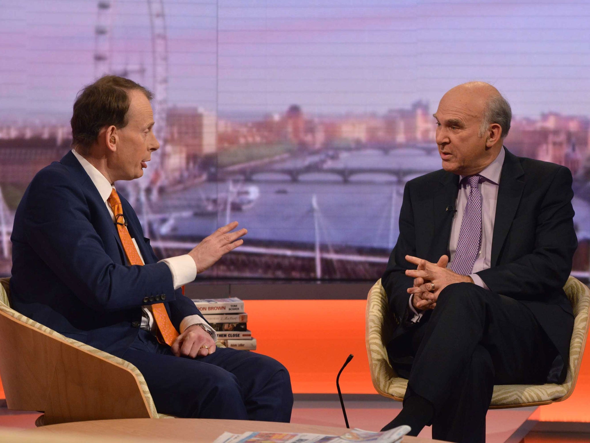 Andrew Marr (left) and Vince Cable appearing on BBC1's The Andrew Marr Show - the Business Secretary accused the Conservatives of 'panicking' about immigration because the party is under pressure from UKIP
