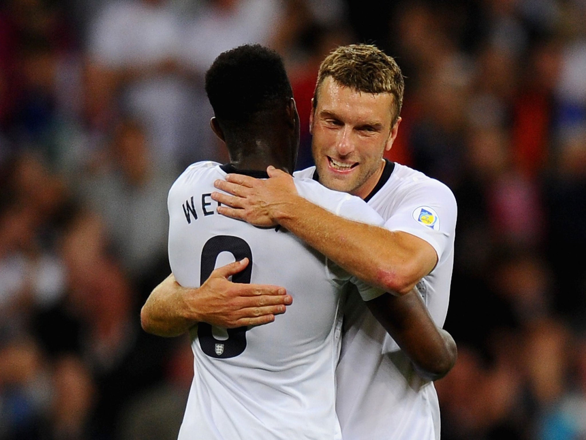 Rickie Lambert and Danny Welbeck celebrate England's third goal against Moldova
