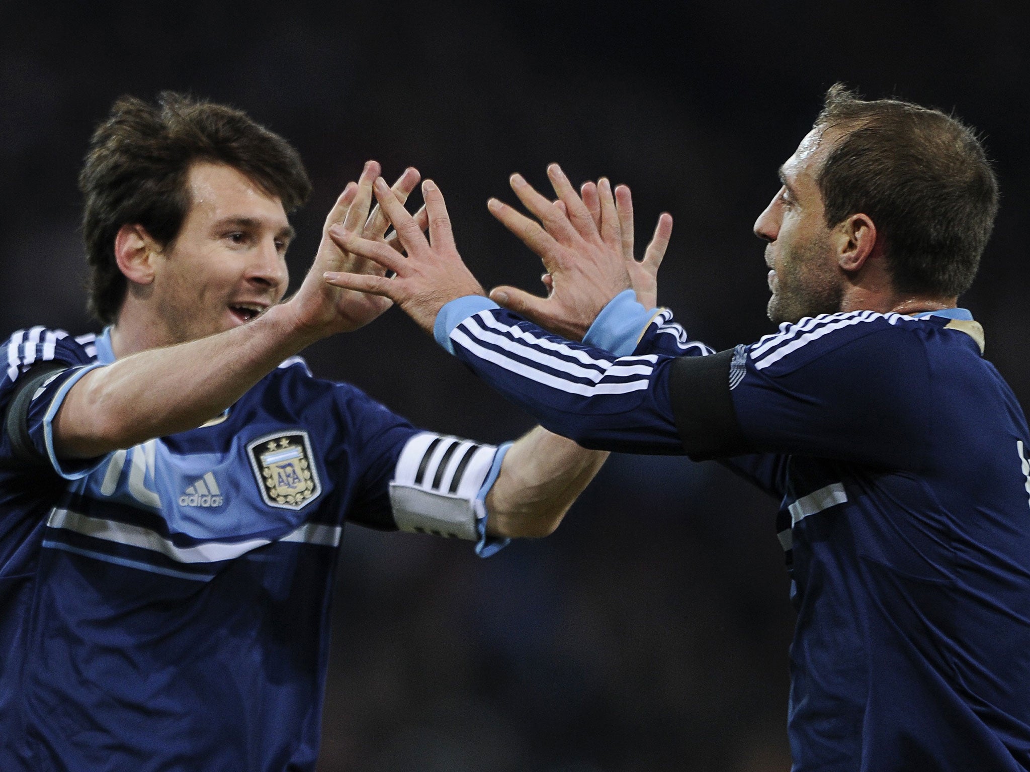Lionel Messi (left) and Pablo Zabaleta celebrate for Argentina. Could they soon be celebrating goal for Manchester City?