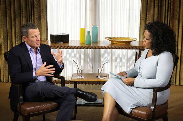 Oprah Winfrey speaks with Lance Armstrong during an interview regarding the controversy surrounding his cycling career