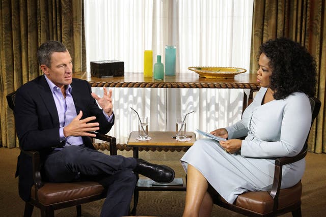 Oprah Winfrey speaks with Lance Armstrong during an interview regarding the controversy surrounding his cycling career