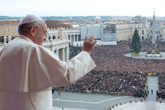 Pope Francis delivers his first 'Urbi et Orbi' (to the city and world) message from the balcony overlooking St. Peter's Square at the Vatican