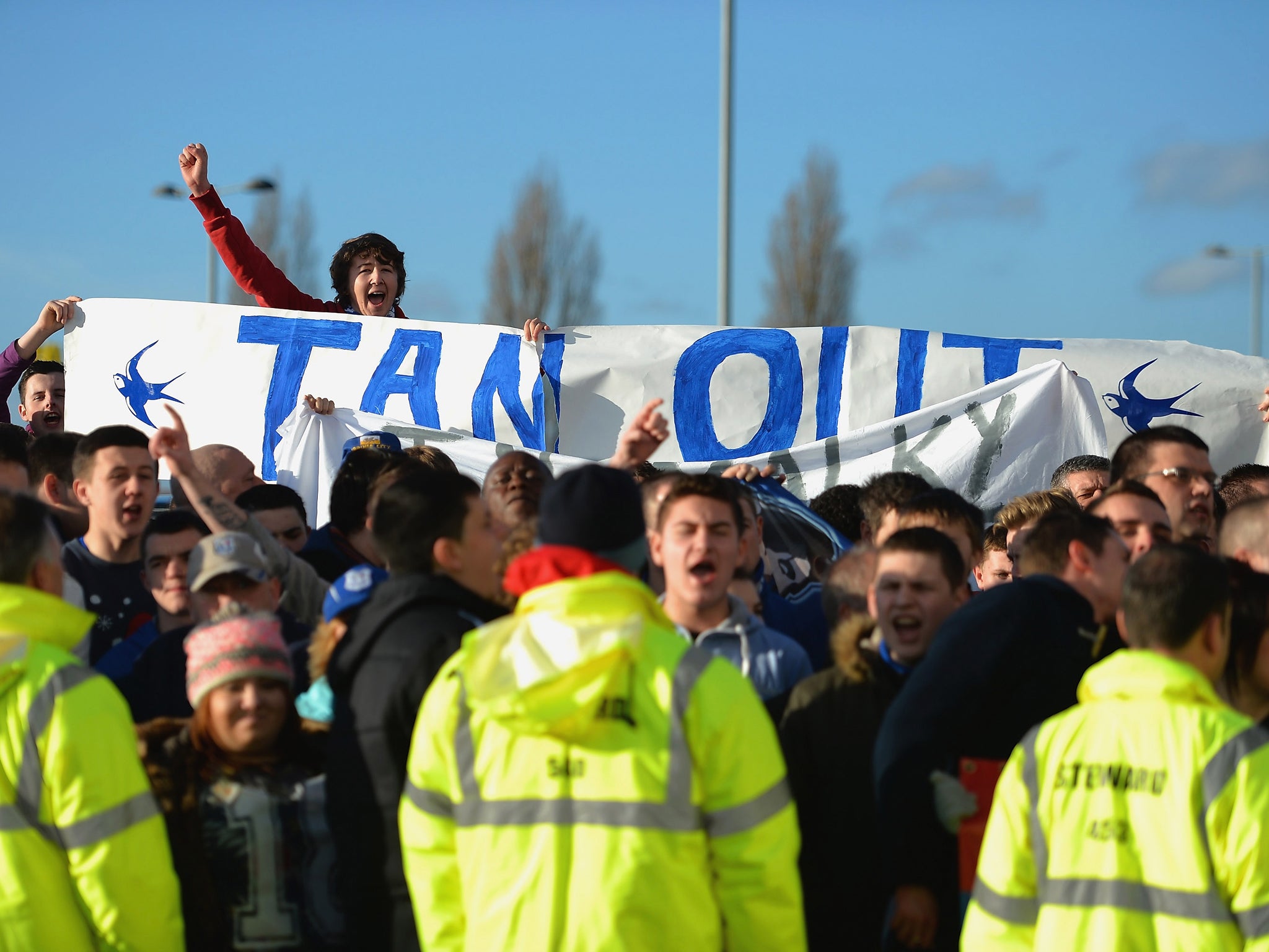 Cardiff City fans protest against club owner Vincent Tan following the furore surrounding the future of manager Malky Mackay