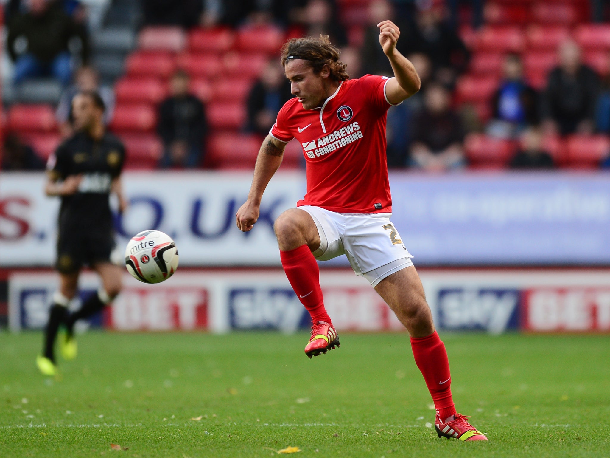 Lawrie Wilson, pictured earlier in the season against Wigan, scored twice for Charlton in their 3-2 win over Brighton