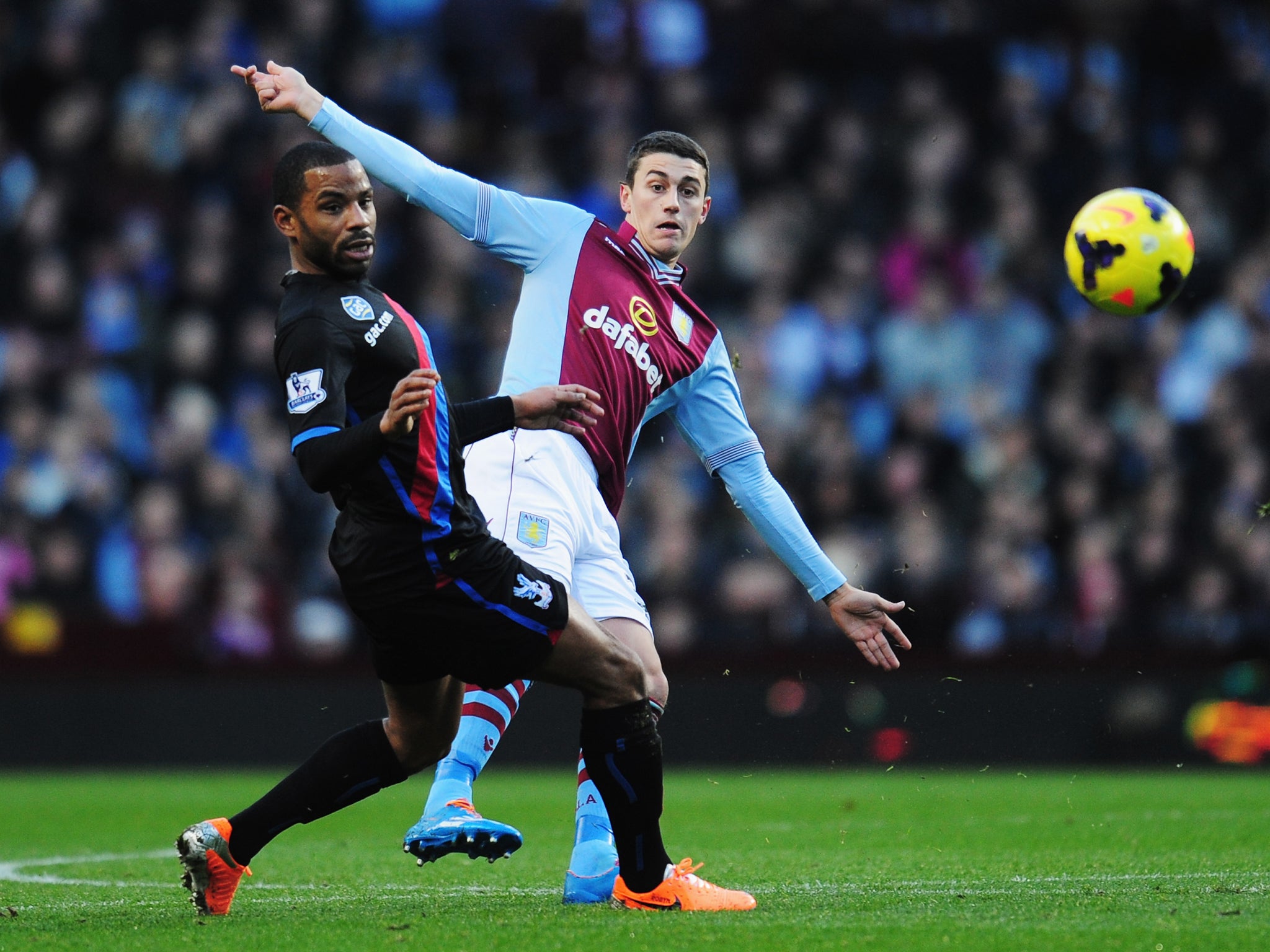 Jason Puncheon (L) and Matthew Lowton (R) compete for the ball during the match between Aston Villa and Crystal Palace