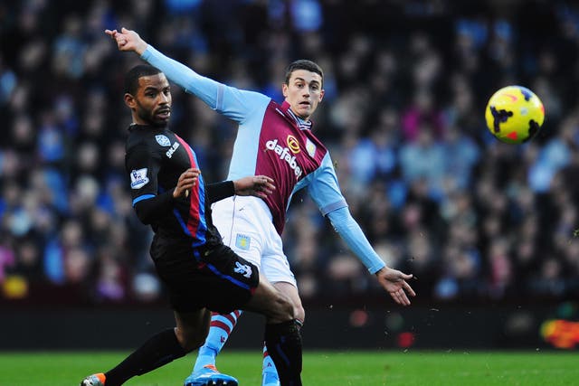 Jason Puncheon (L) and Matthew Lowton (R) compete for the ball during the match between Aston Villa and Crystal Palace