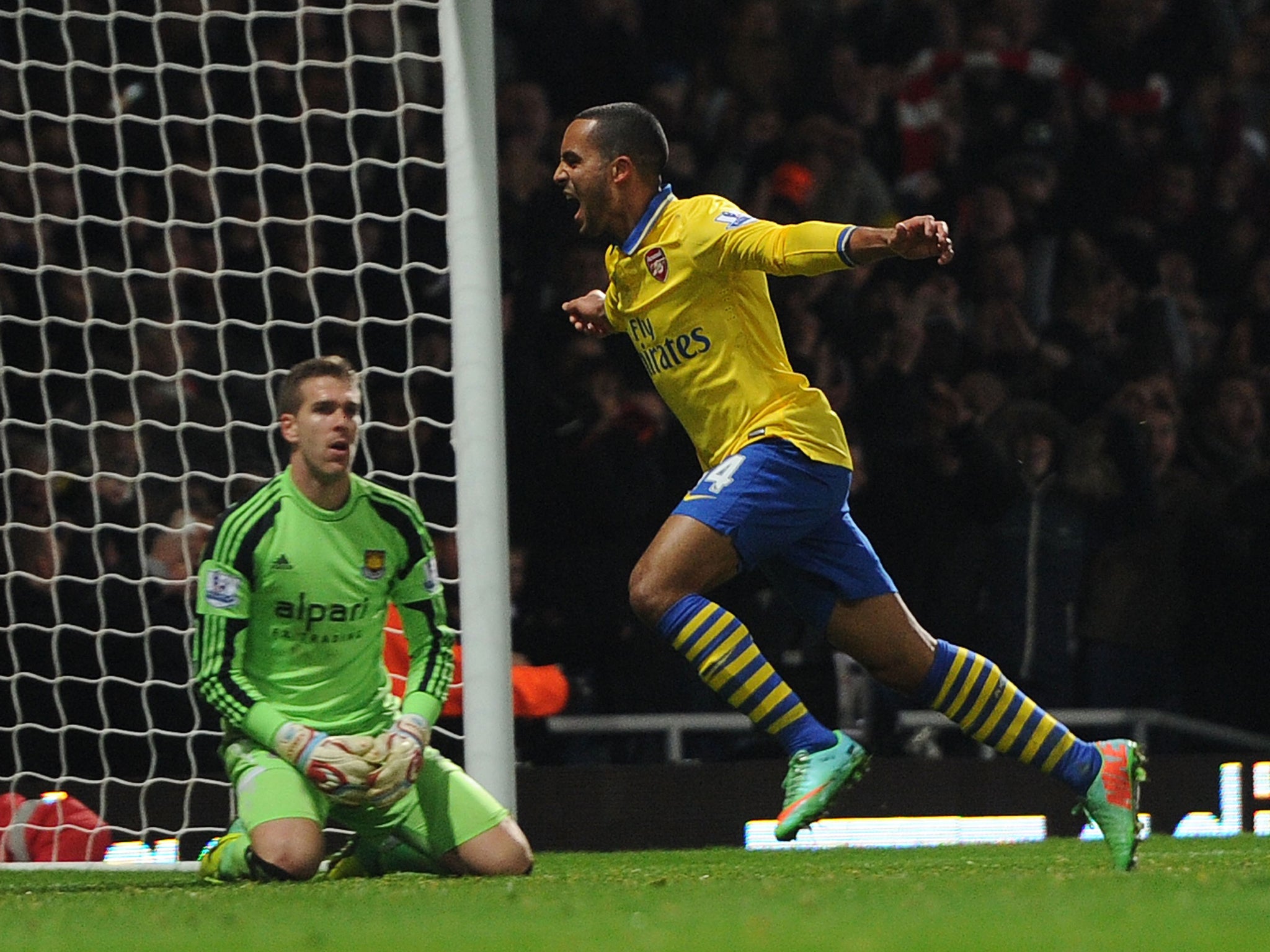 Theo Walcott celebrates after giving Arsenal the lead in their 3-1 win over West Ham