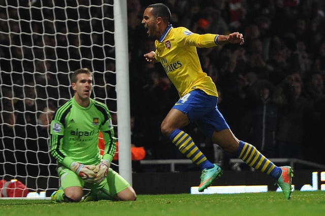Theo Walcott celebrates after giving Arsenal the lead in their 3-1 win over West Ham
