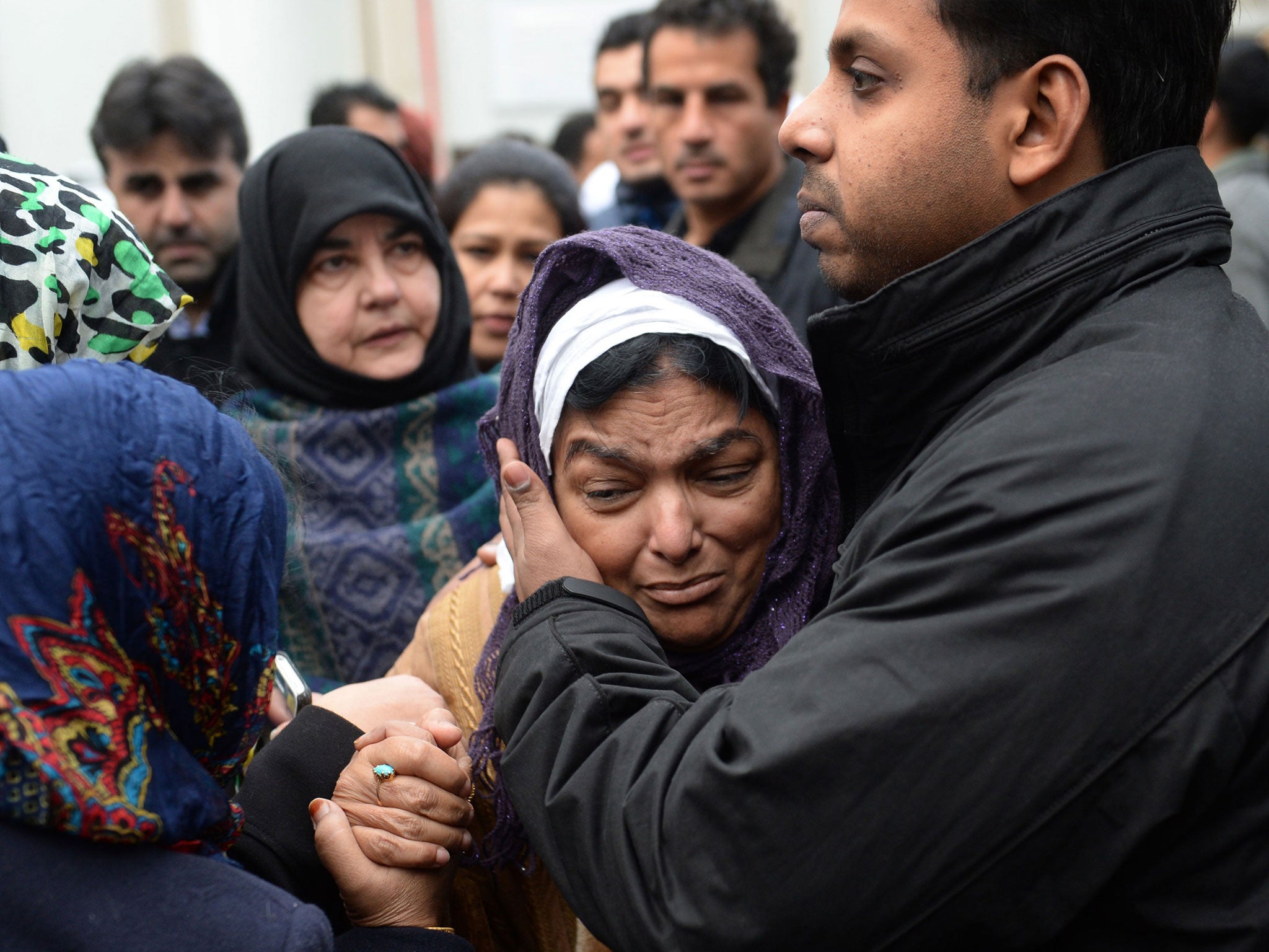 Fatima Khan, mother of Abbas Khan, is comforted by her son