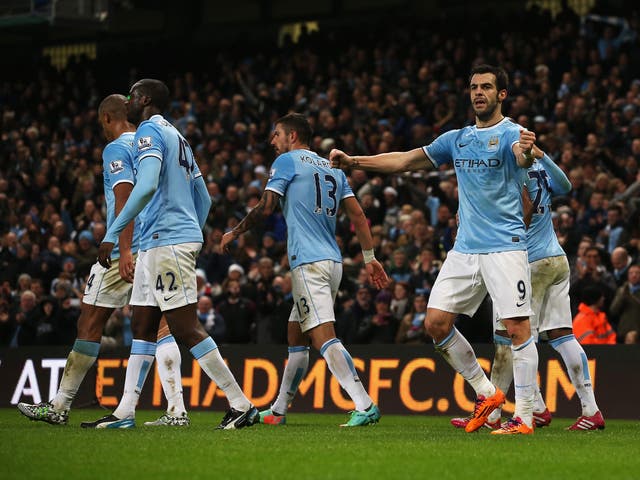 Alvaro Negredo celebrates after he scores for Manchester City against Liverpool