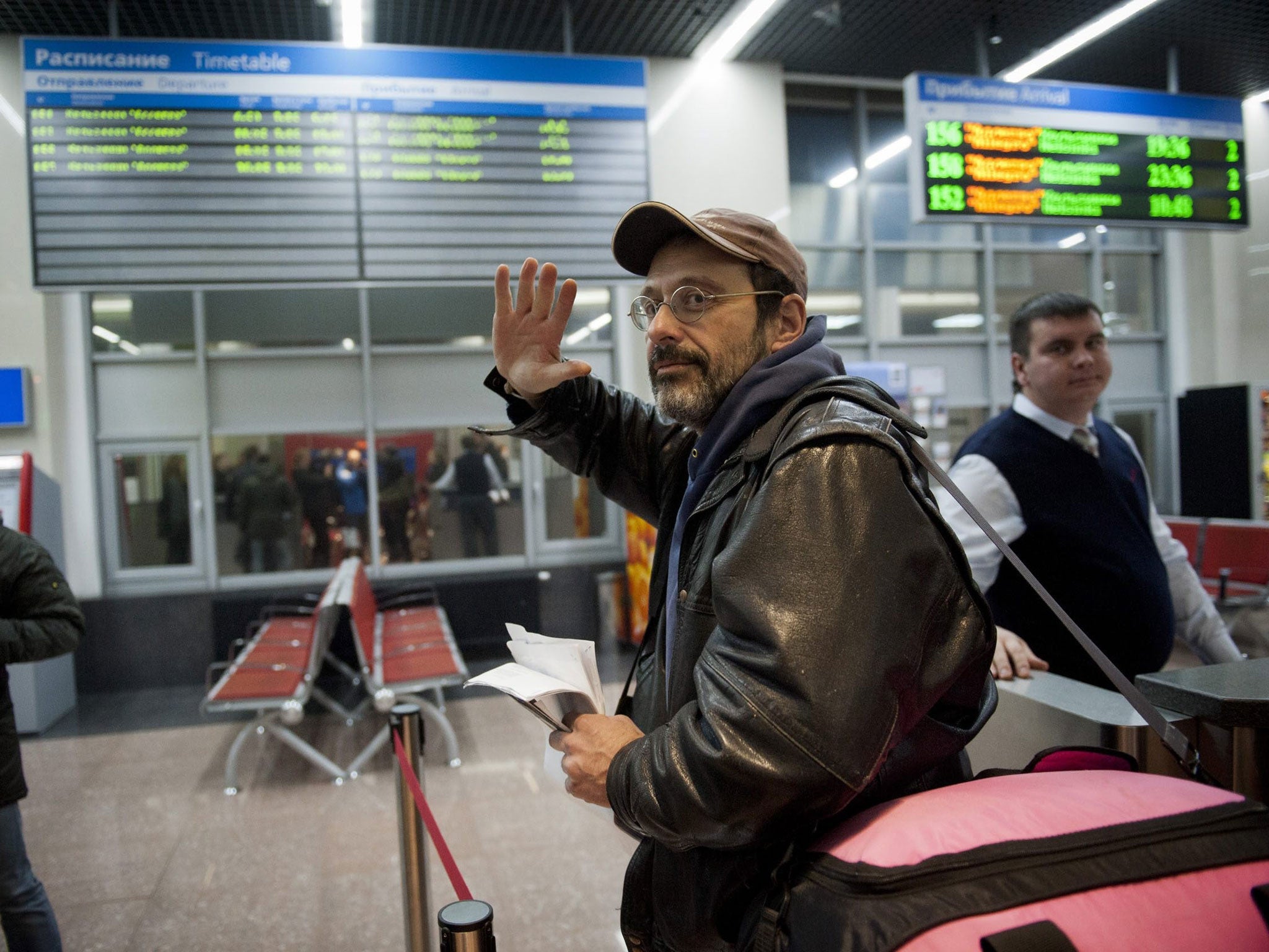 Dima Litvinov became the first member of the so-called 'Arctic 30' to leave Russia; boarding a train at a railway station in St. Petersburg