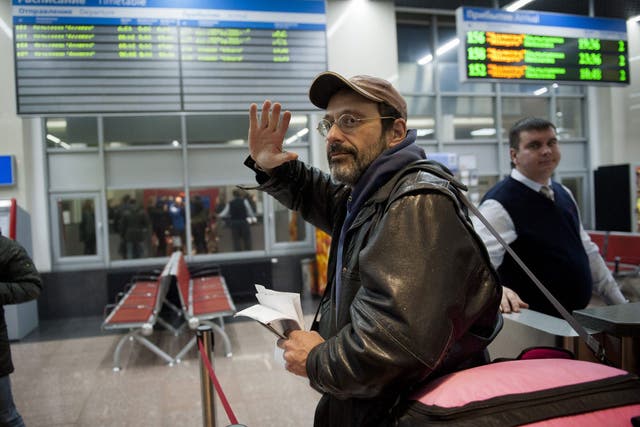Dima Litvinov became the first member of the so-called 'Arctic 30' to leave Russia; boarding a train at a railway station in St. Petersburg