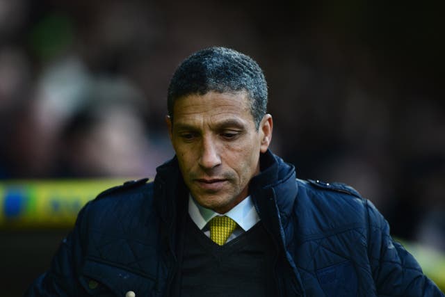 Norwich manager Chris Hughton looks on