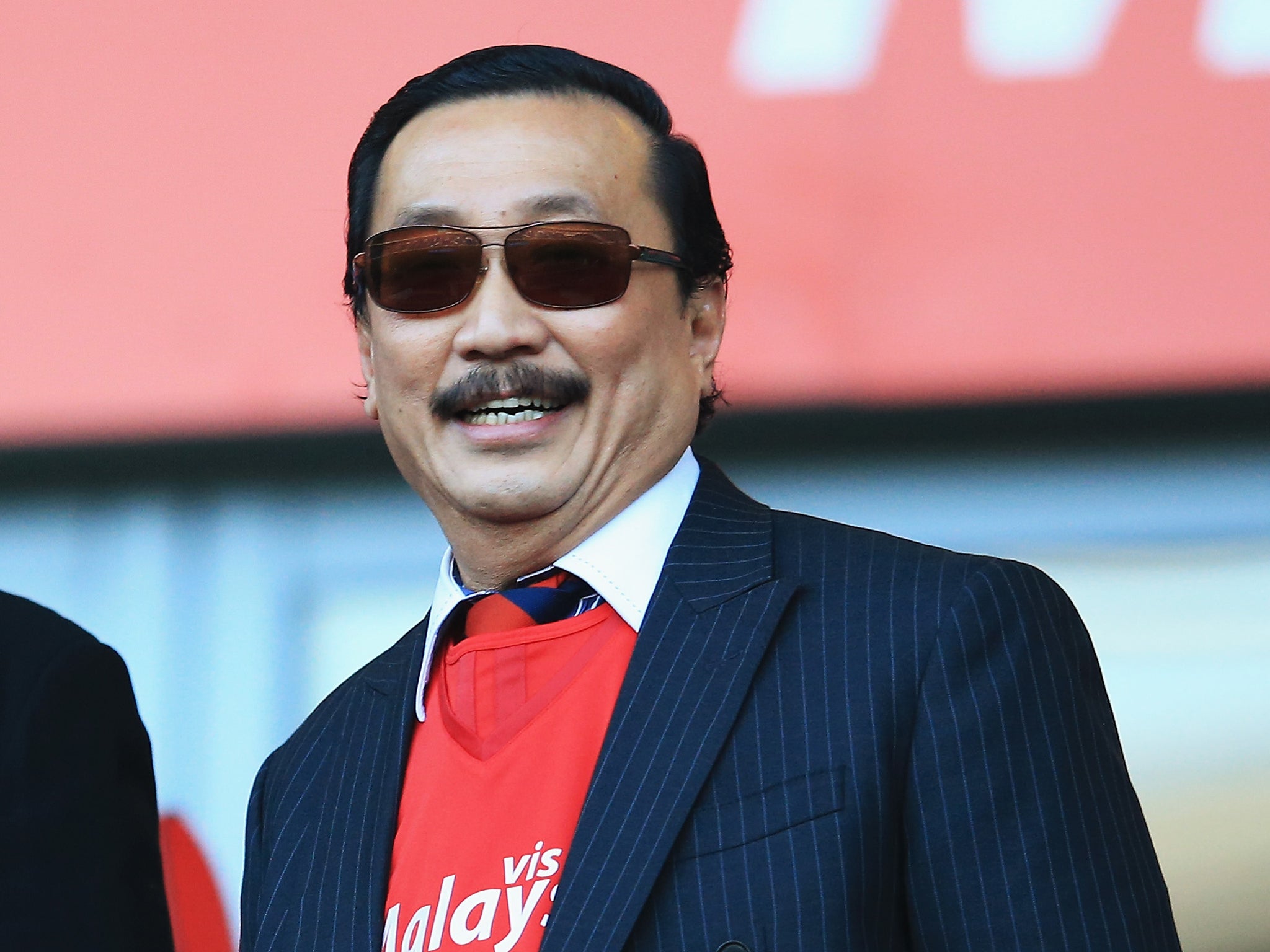 Cardiff City owner Vincent Tan has defended his match-day outfit