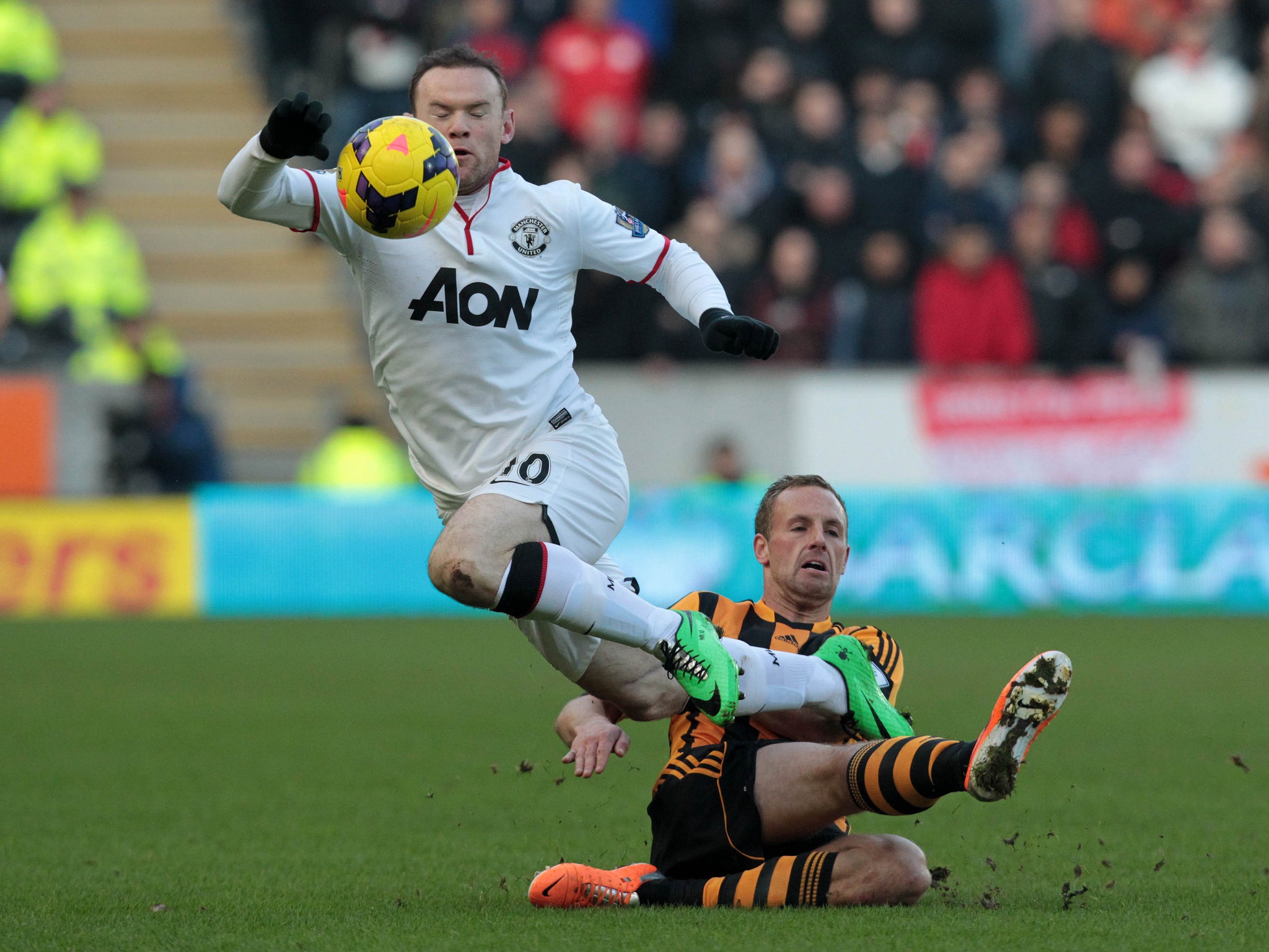 Manchester United striker Wayne Rooney goes to ground legitimately after being fouled during the win at Hull.