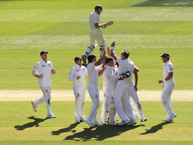 England celebrate after Stuart Broad takes the wicket of Ryan Harris late on day two
