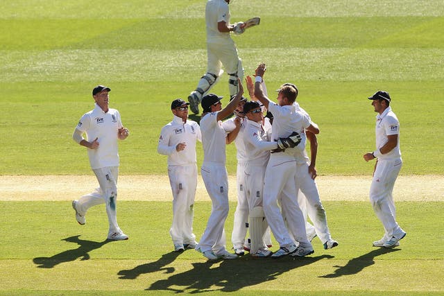 England celebrate after Stuart Broad takes the wicket of Ryan Harris late on day two