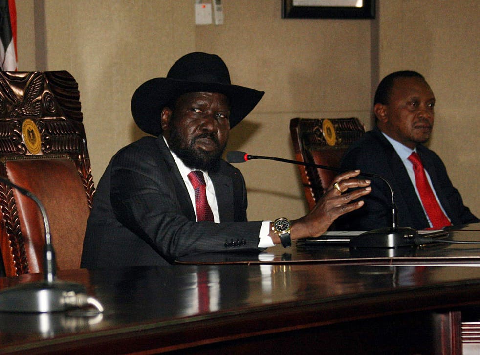 South Sudan President, Salva Kiir, left, sitting with his Kenyan counterpart Uhuru Kenyatta - South Sudan's neighbours threw their weight behind President Salva Kiir, saying they would not accept any bid to overthrow his democratically elected government