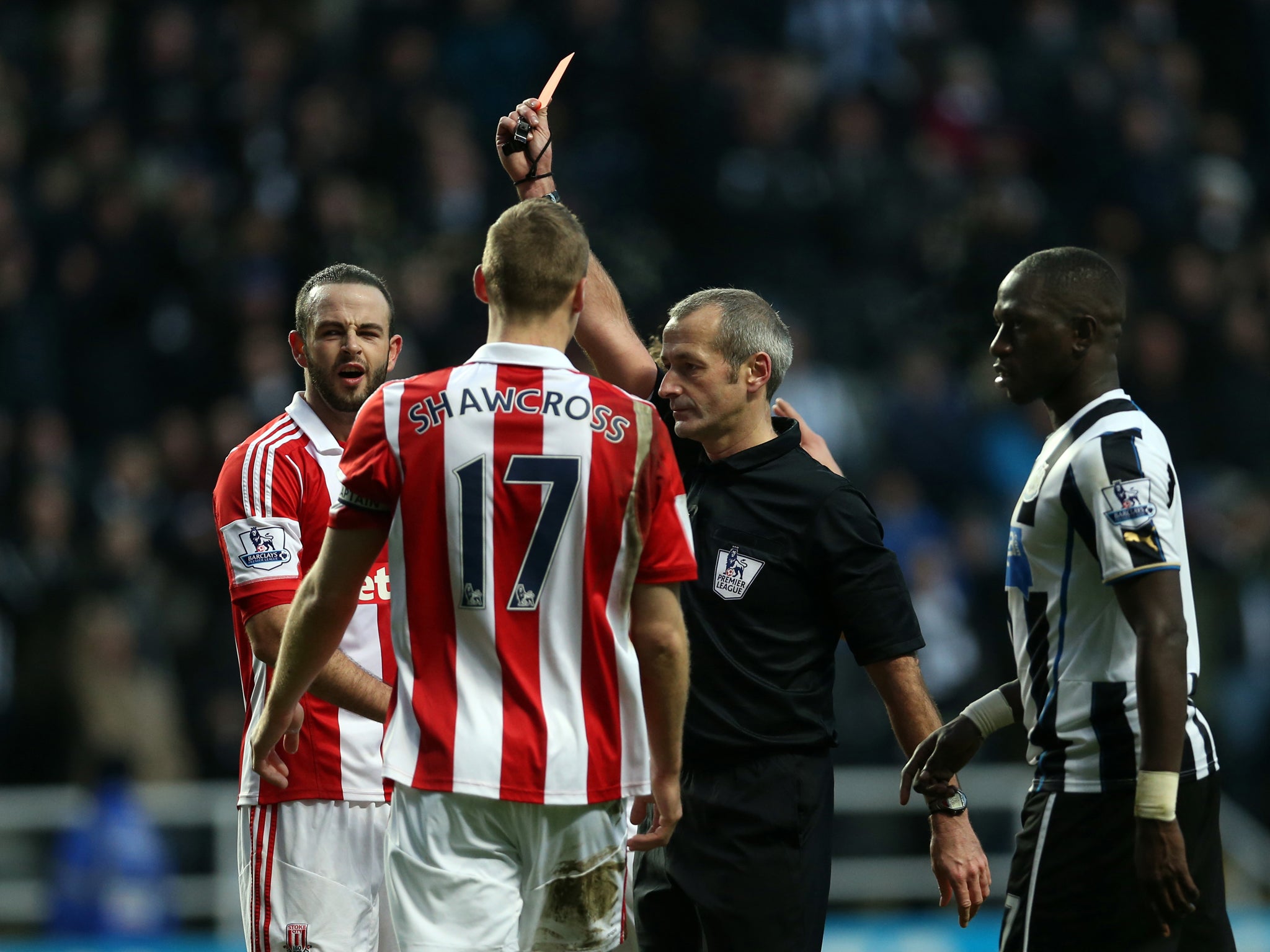 Stoke defender Marc Wilson is sent off after giving away a penalty in the 5-1 defeat to Newcastle on Boxing Day